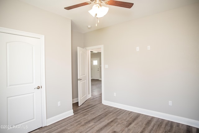 unfurnished bedroom featuring ceiling fan and wood-type flooring