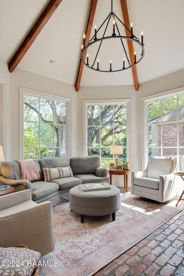 living room featuring beamed ceiling, a chandelier, high vaulted ceiling, and a healthy amount of sunlight