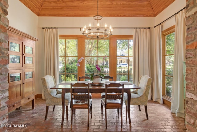 dining area featuring wooden ceiling, vaulted ceiling, and a notable chandelier