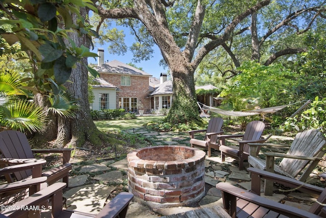 view of yard with a patio and a fire pit