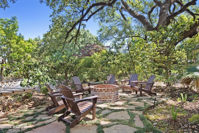 view of terrace with a fire pit