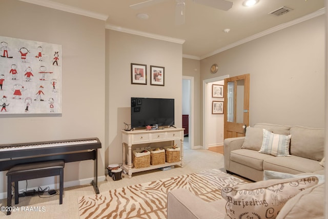 carpeted living room with ceiling fan and ornamental molding