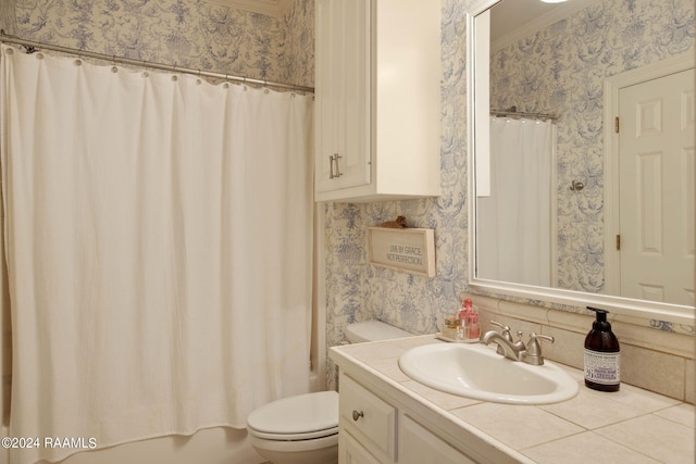 bathroom with crown molding, vanity, and toilet