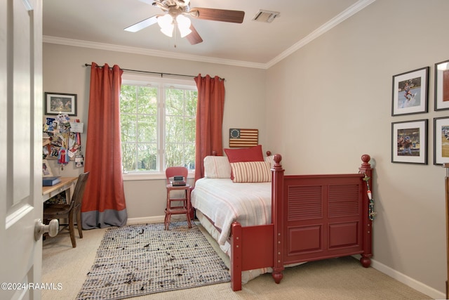 carpeted bedroom featuring crown molding and ceiling fan