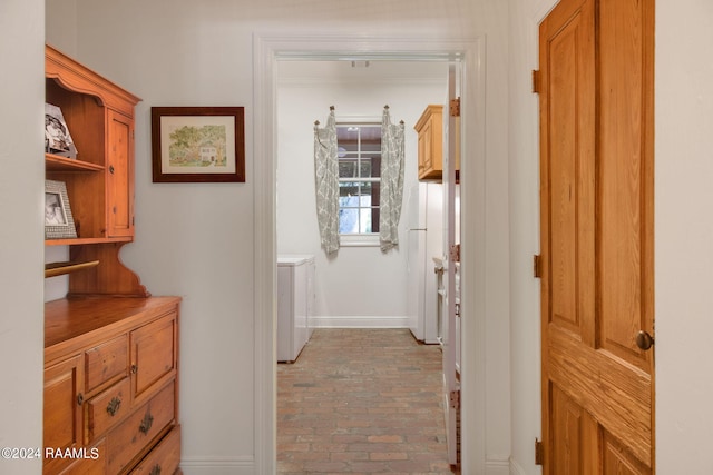 corridor with separate washer and dryer