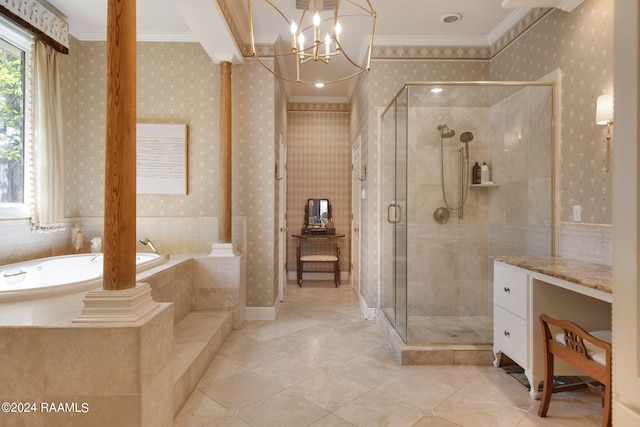 bathroom with tile flooring, separate shower and tub, and decorative columns