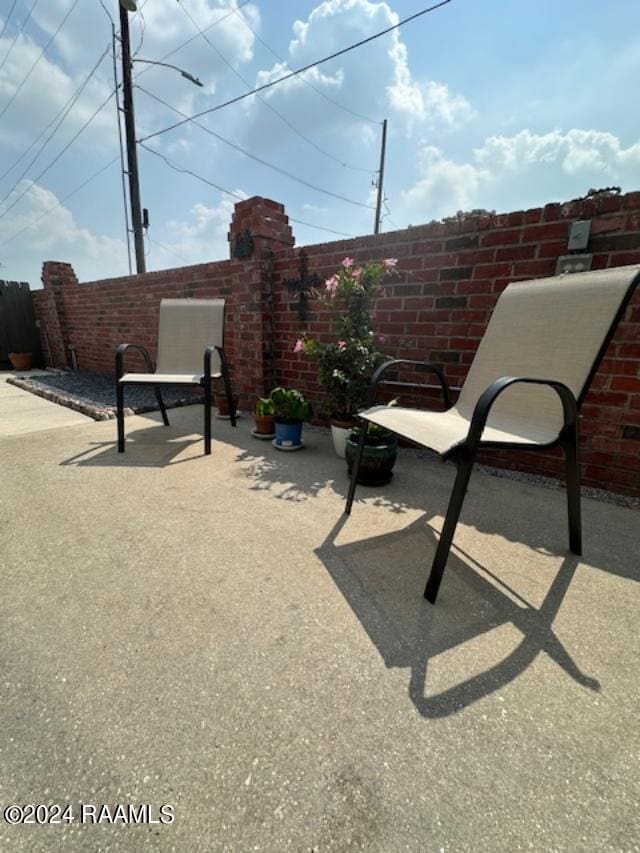 view of patio featuring fence