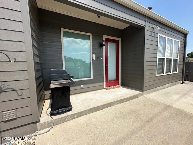 property entrance with a patio