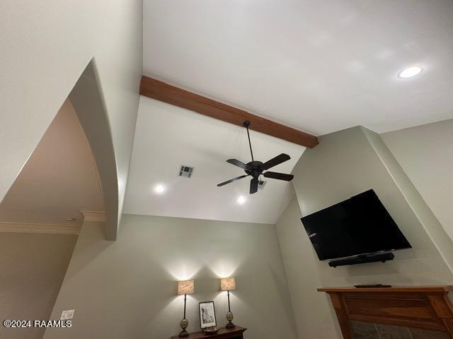 interior details with beamed ceiling and ceiling fan