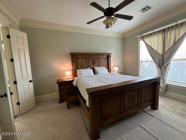 bedroom with baseboards, visible vents, crown molding, and light colored carpet