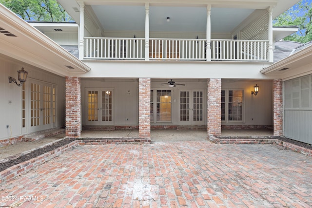 doorway to property with a patio area, french doors, ceiling fan, and a balcony