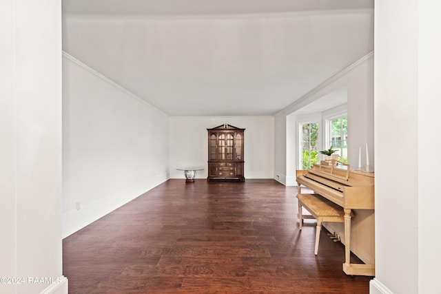 living room featuring crown molding and dark hardwood / wood-style floors