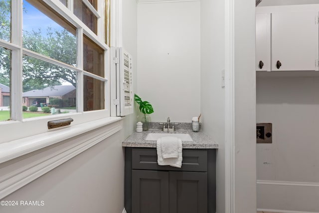 bathroom featuring vanity with extensive cabinet space