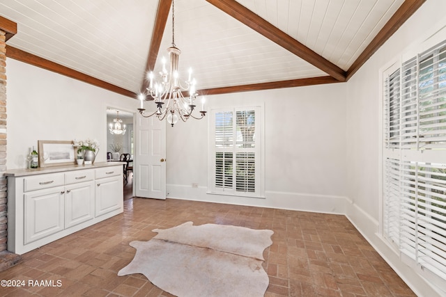 sitting room with lofted ceiling with beams and a chandelier