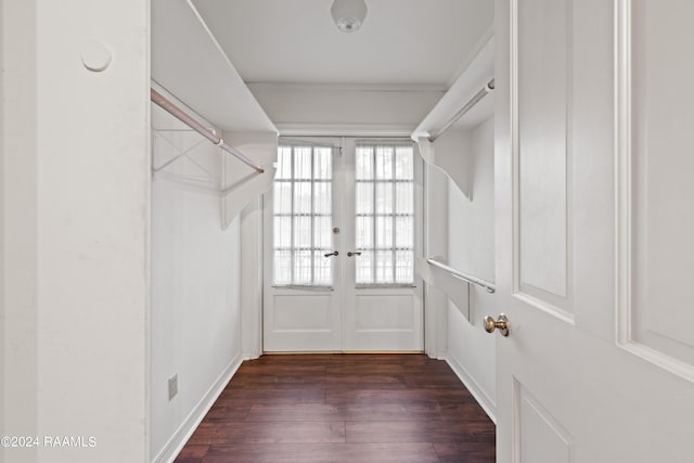 spacious closet featuring french doors and wood-type flooring