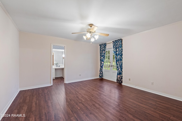 spare room with ceiling fan, crown molding, and dark hardwood / wood-style flooring