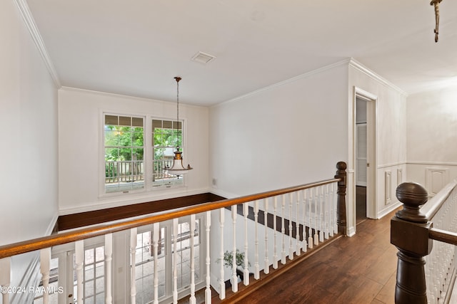 hall with ornamental molding and dark hardwood / wood-style flooring