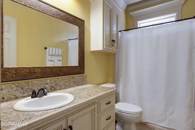 bathroom featuring tile patterned flooring, vanity, and toilet