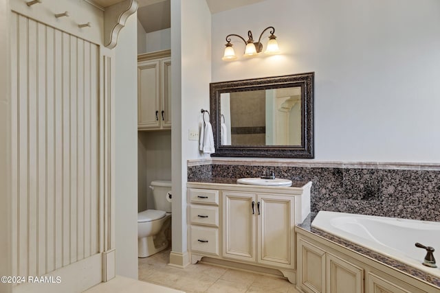 bathroom with a bathing tub, tile patterned flooring, vanity, and toilet