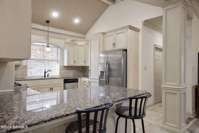 kitchen featuring sink, stainless steel appliances, vaulted ceiling with beams, dark stone counters, and a breakfast bar