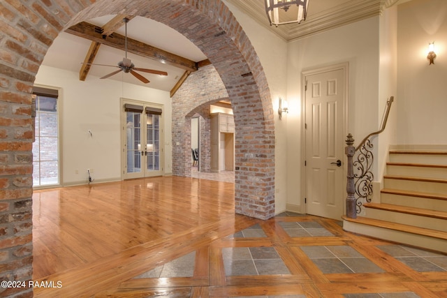 foyer featuring french doors, ceiling fan, beam ceiling, high vaulted ceiling, and hardwood / wood-style floors