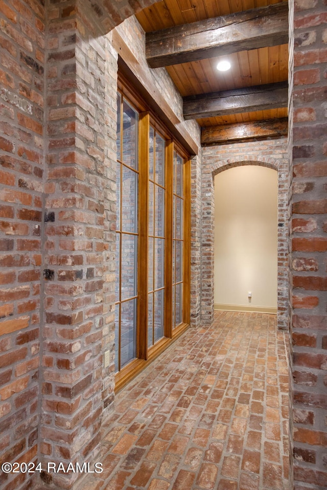 corridor featuring beam ceiling and wood ceiling