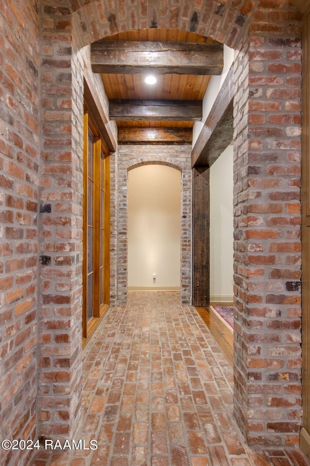 hall with beamed ceiling and wood ceiling