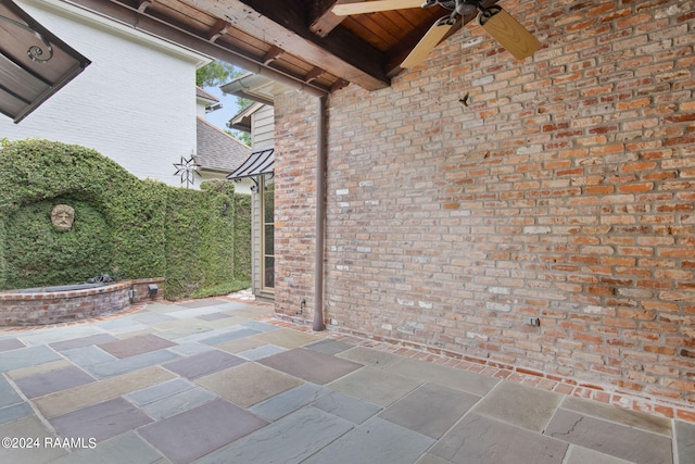 view of patio / terrace featuring ceiling fan