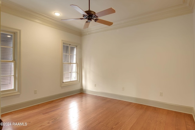 unfurnished room with ceiling fan, light wood-type flooring, and crown molding