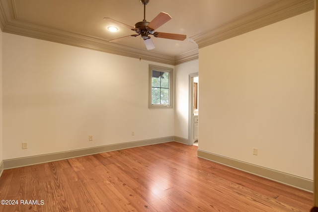 spare room featuring light hardwood / wood-style floors, ceiling fan, and ornamental molding