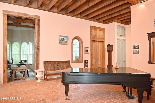 game room featuring beamed ceiling