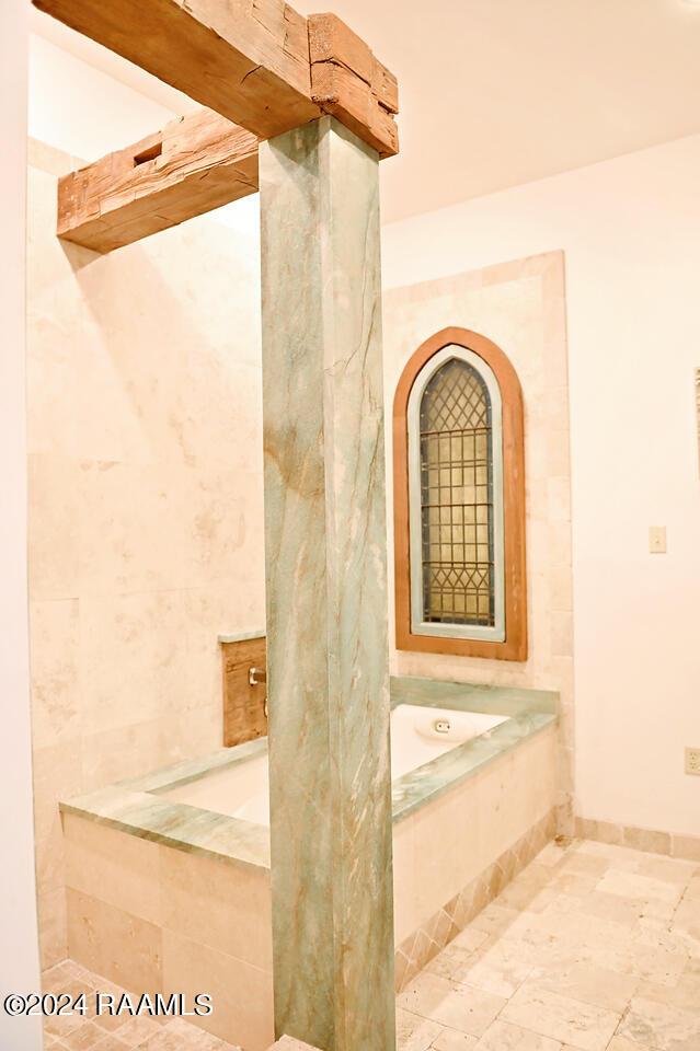 bathroom with tiled bath