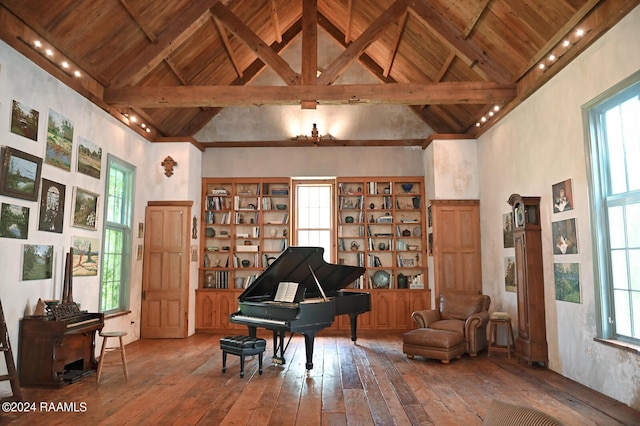 miscellaneous room featuring high vaulted ceiling, wooden ceiling, hardwood / wood-style flooring, and beamed ceiling