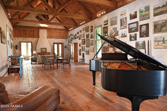 miscellaneous room with high vaulted ceiling, wooden ceiling, hardwood / wood-style floors, and beam ceiling