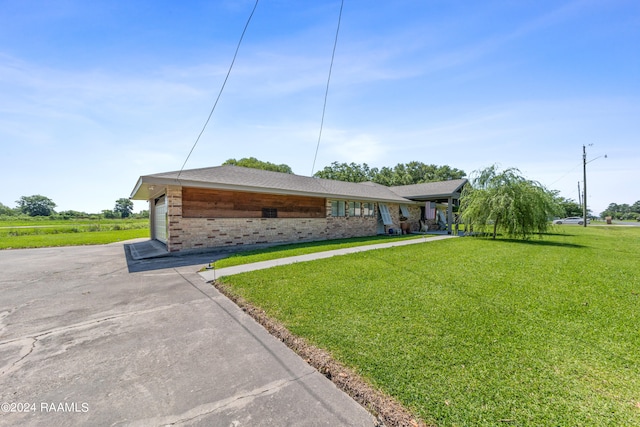 ranch-style house with a front lawn