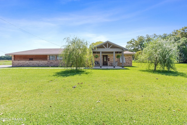 rear view of house with a lawn