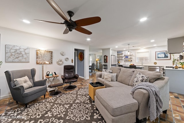 living room with sink and ceiling fan