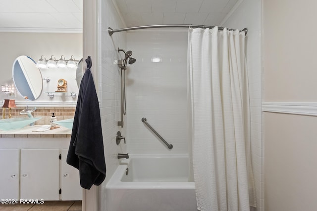 bathroom featuring tile flooring, ornamental molding, vanity, and shower / tub combo