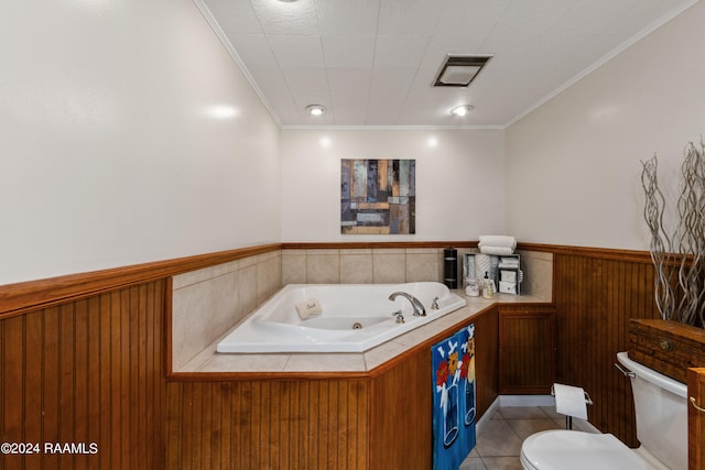 bathroom featuring a washtub, ornamental molding, tile floors, and toilet