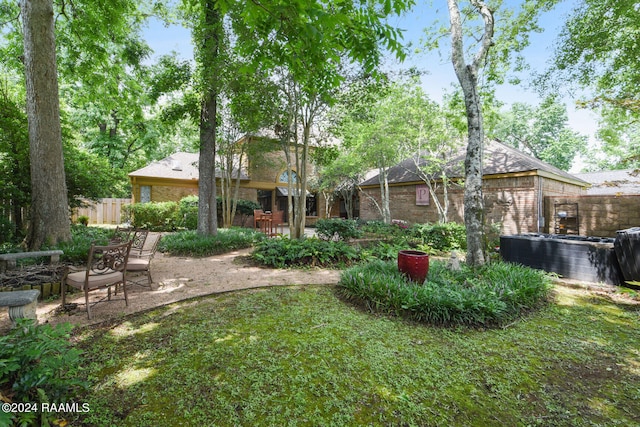 back of property with a patio area, fence, and brick siding