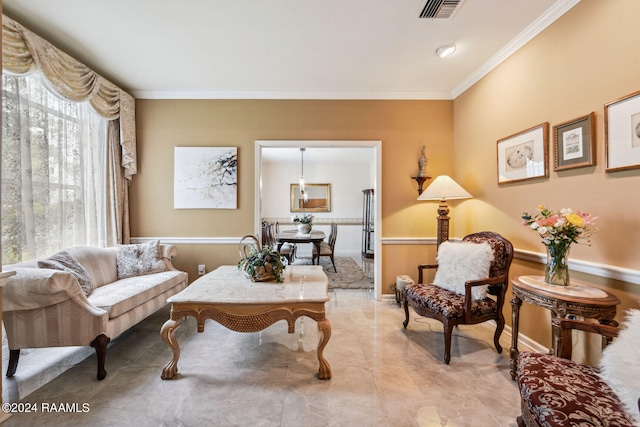 living room with crown molding, tile flooring, and plenty of natural light