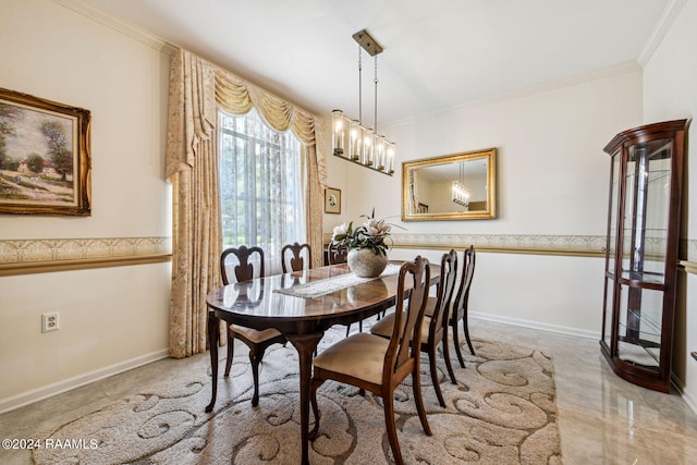 tiled dining area with a chandelier and crown molding