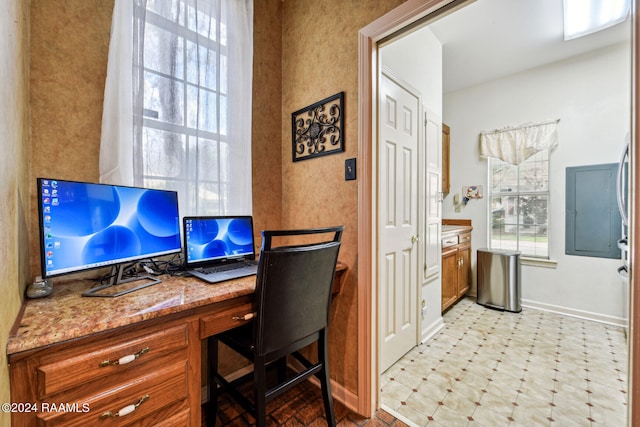 office featuring baseboards and light floors