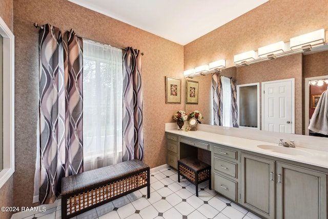 bathroom featuring an AC wall unit, tile patterned floors, vanity, and wallpapered walls