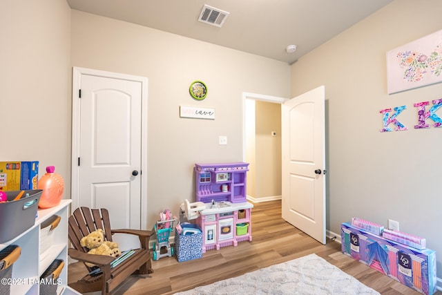 playroom with light wood-type flooring