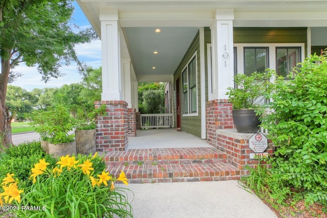 entrance to property with a porch