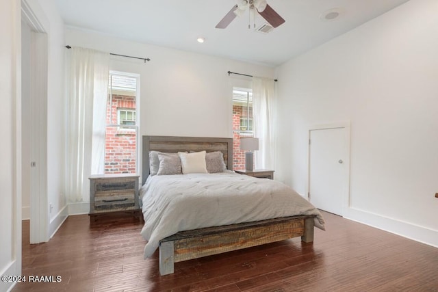 bedroom featuring dark hardwood / wood-style floors and ceiling fan