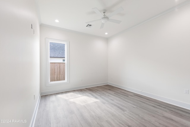 unfurnished room featuring light hardwood / wood-style floors, ceiling fan, and crown molding