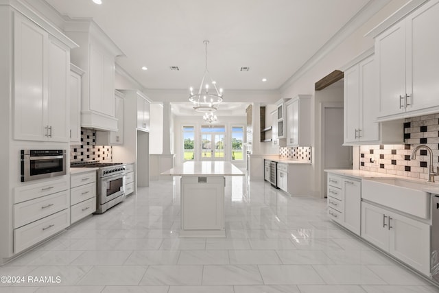 kitchen featuring marble finish floor, decorative backsplash, high end stainless steel range, and a sink