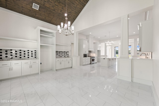 interior space with sink and high vaulted ceiling